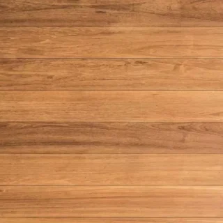 Close-up of installed wood-look flooring featuring natural grain patterns and a seamless plank layout in a residential interior.
